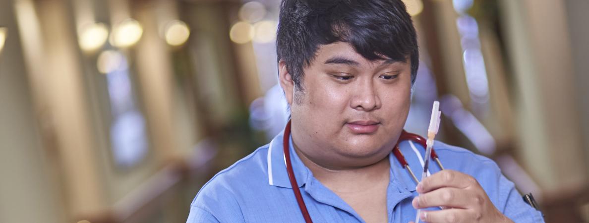 Jacob Sucgang working as nurse 