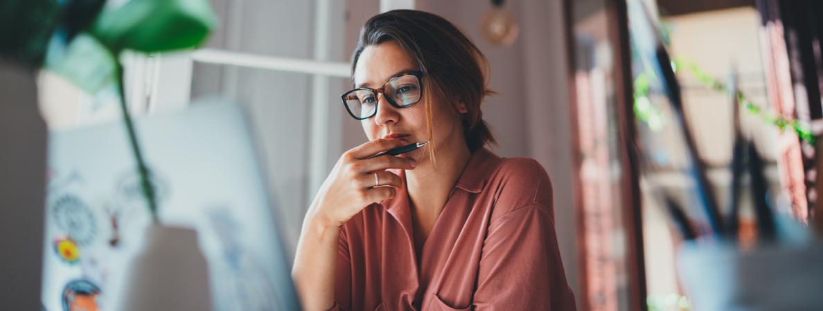 Young female browsing on a laptop.
