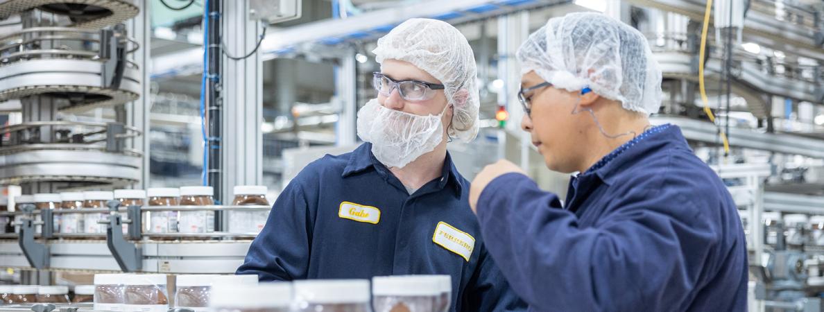 Manufacturing Engineering Technicians working on the line in factory