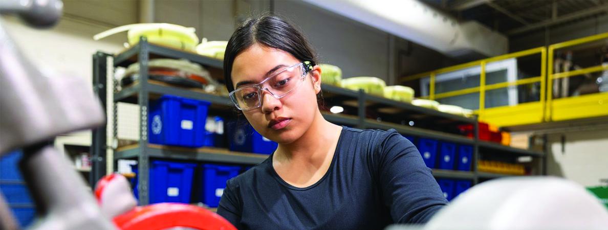 Vanessa with safety goggles posing.