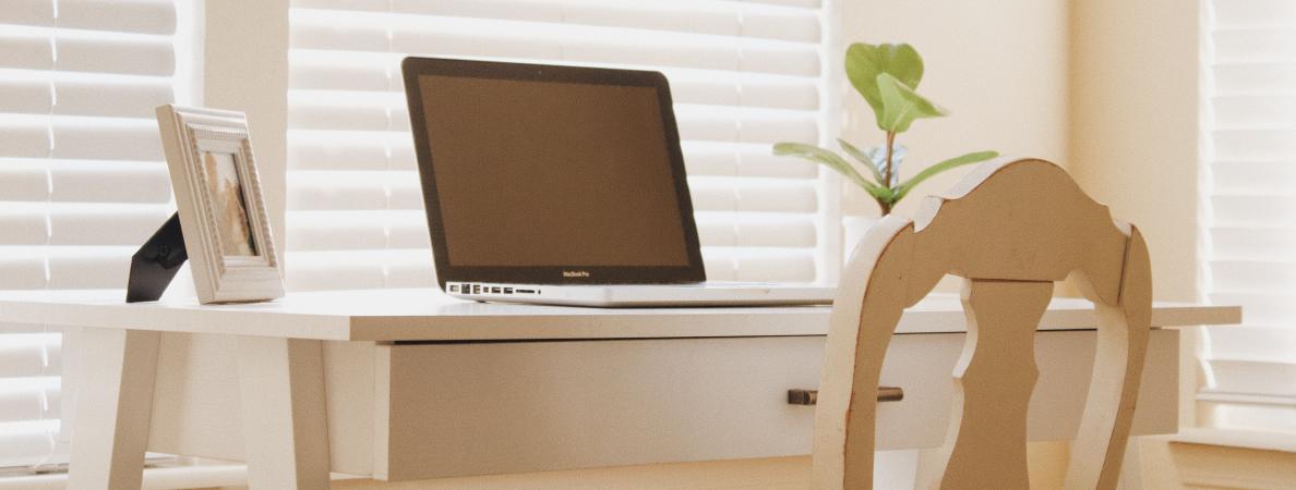 laptop on clean white desk