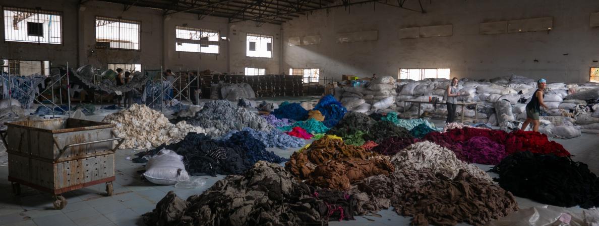 Clothes piled up in a factory