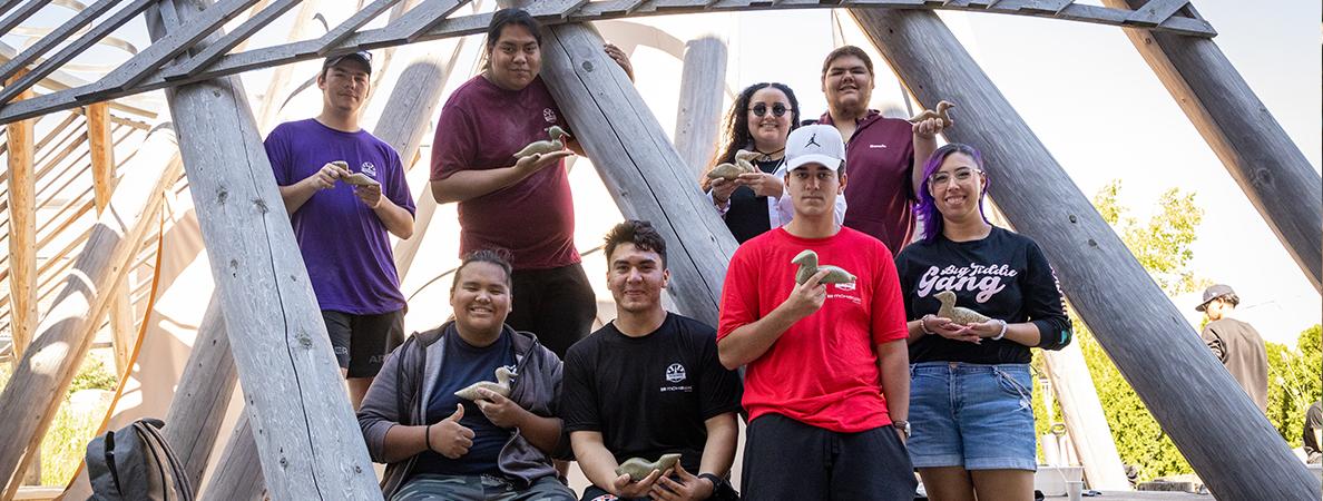 A group of Pathfinder students showing their soapstone carving at Mohawk College