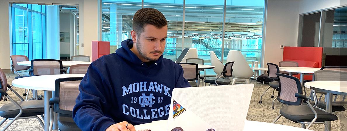 Uros working on his laptop