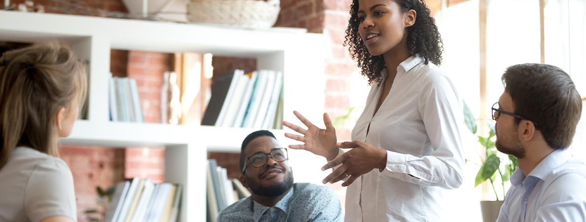 woman speaking passionately as peers listen attentively