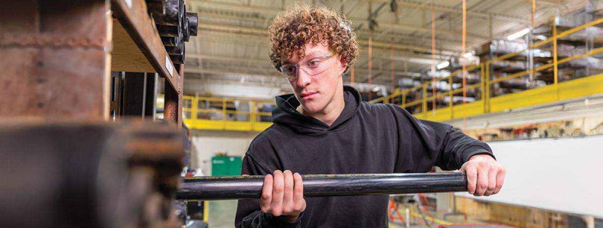 Student fitting pipe.