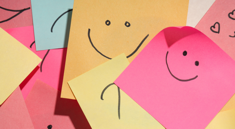 Colourful sticky notes with smiley faces and questions marks.