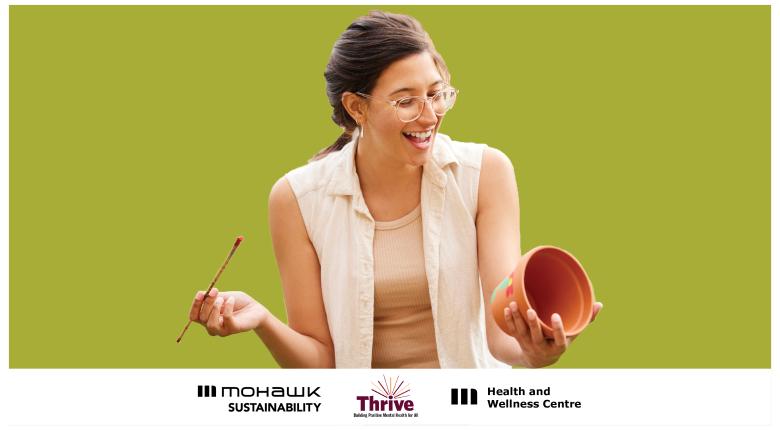 woman paints and smiles