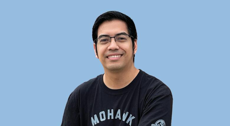 Mohawk student smiling and posing.