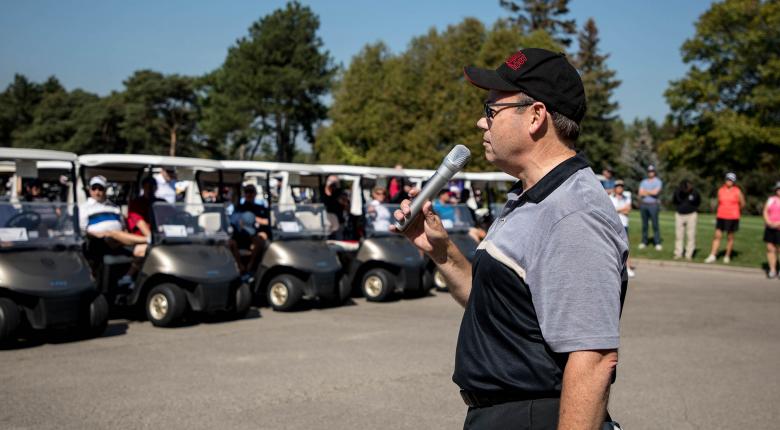 President Ron McKerlie opening remarks to goflers. 