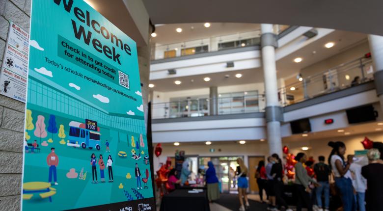 Welcome Week sign and lobby in background