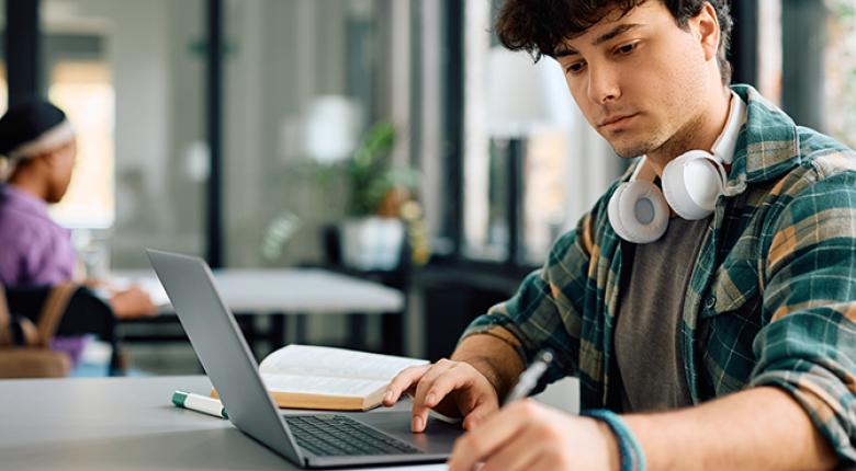 A male person working on a computer
