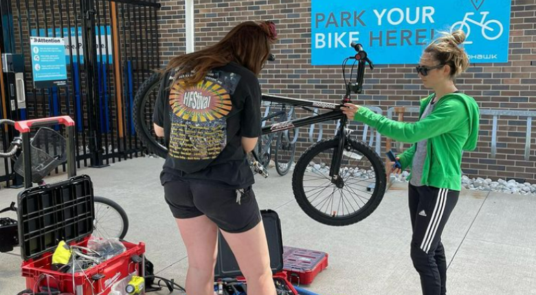 Bike tune ups happening outside of Secure Bike Cage 