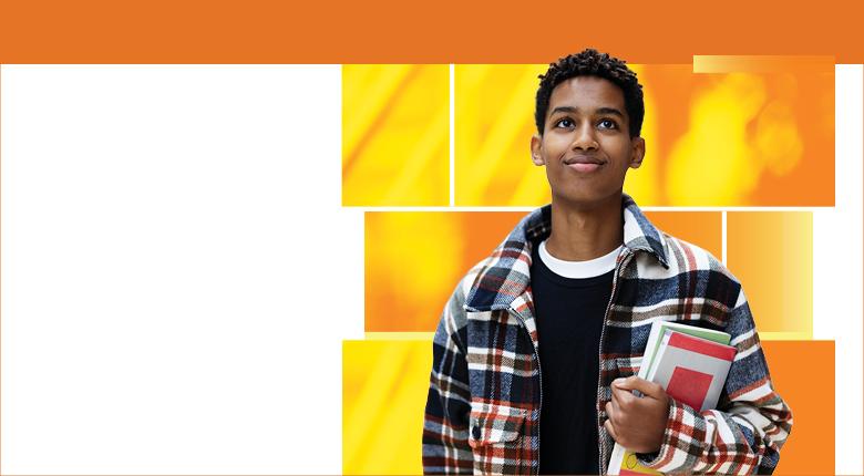Student on orange background holding books