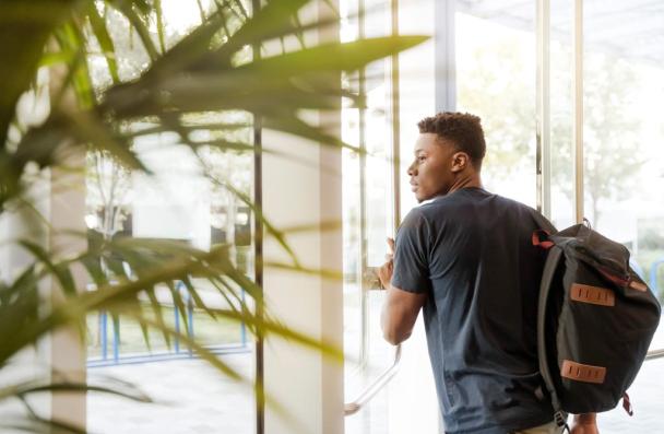 Male walking in an office building