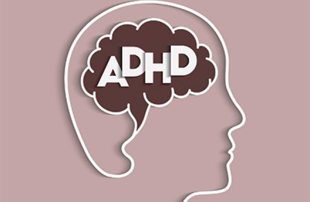 Letters "ADHD" inside an outline of a head
