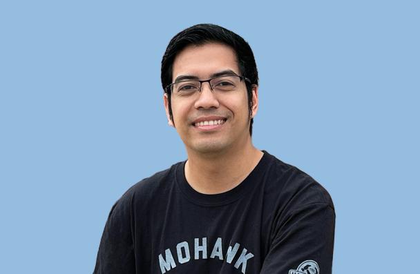 Mohawk student smiling and posing.