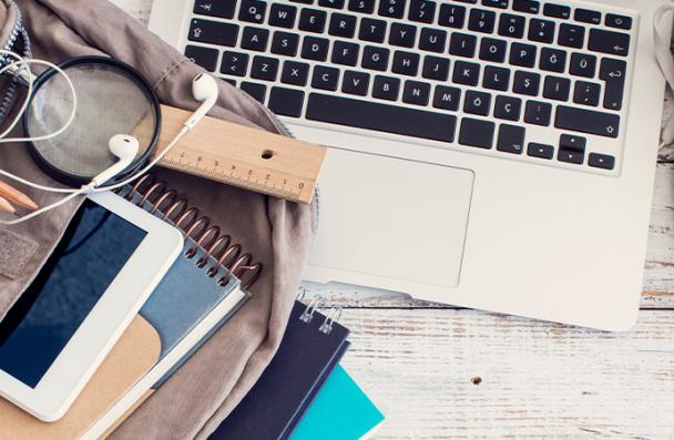 computer and backpack on the floor