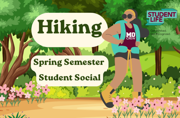 person in a MoCrew shirt and backpack hiking on a flowered trail