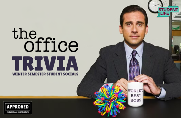 character Michael Scott from the show The Office sitting at a desk with a mug and toy