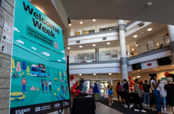 Welcome Week sign and lobby in background