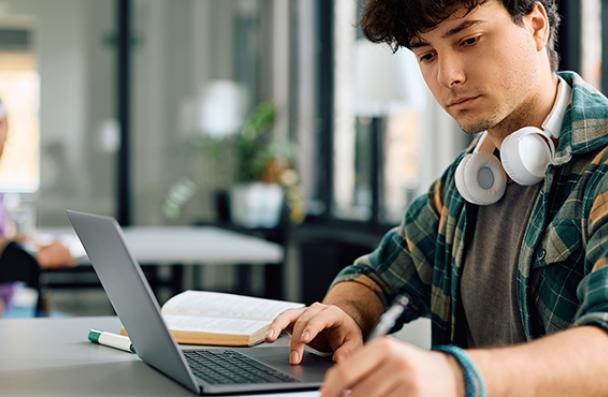 A male person working on a computer