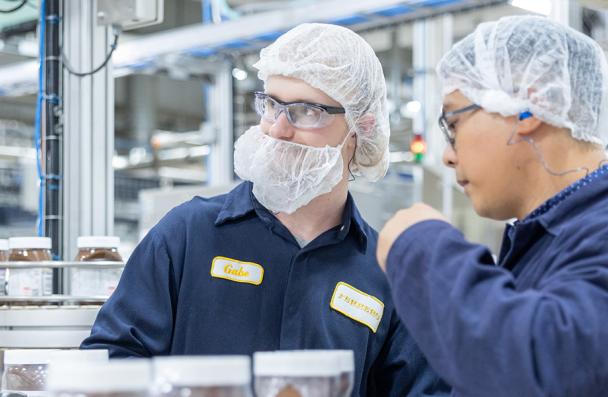 Manufacturing Engineering Technicians working on the line in factory