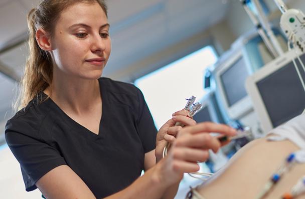 Katherine working with medical monitoring equipment