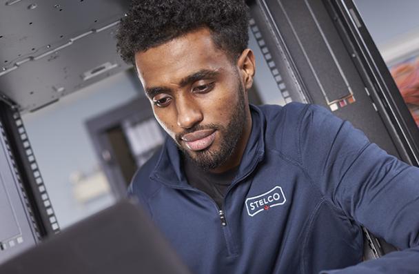 Yafet working on a computer at Stelco