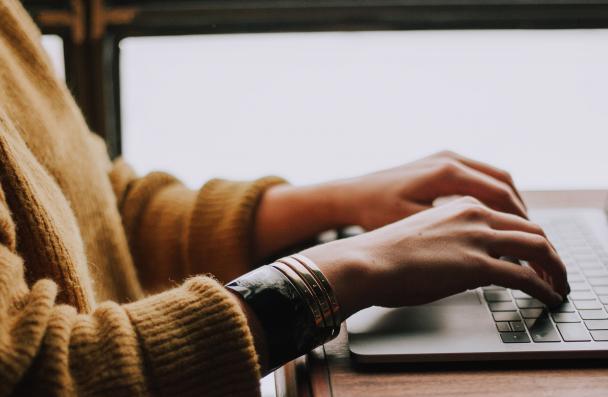 woman typing on laptop