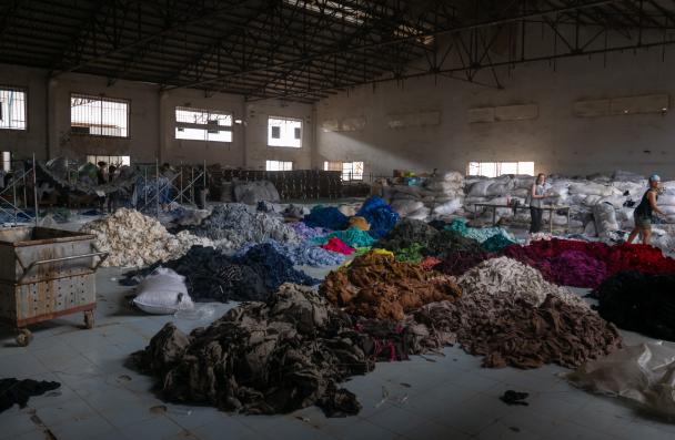 Clothes piled up in a factory