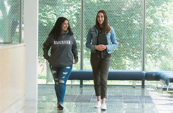 Two Mohawk College students walking in the halls