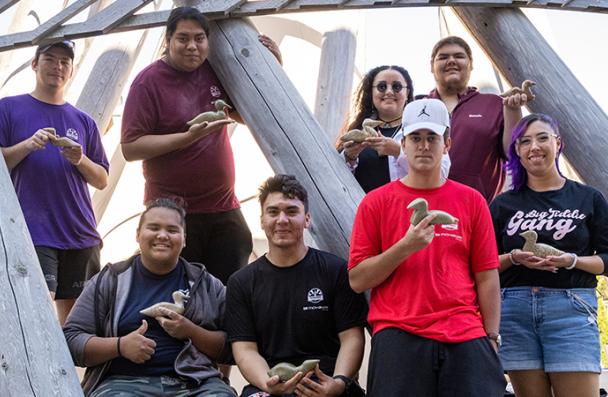 A group of Pathfinder students showing their soapstone carving at Mohawk College