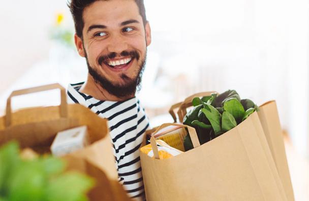 Roommates carrying groceries