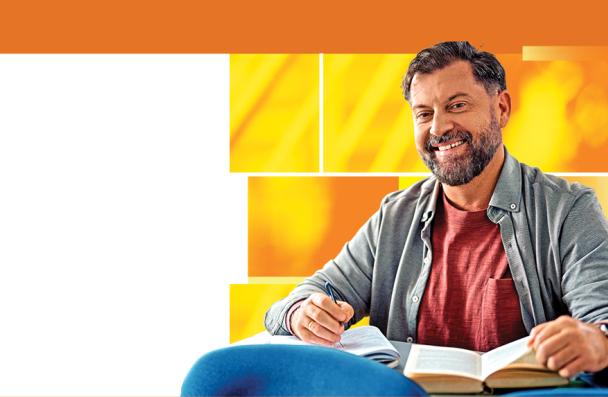 Mature student on orange background studying