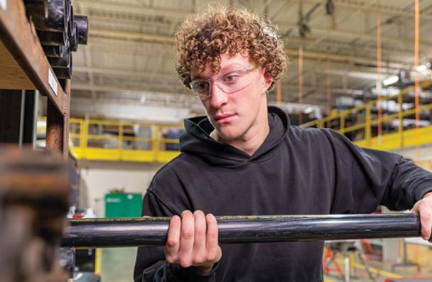 Student fitting pipe.