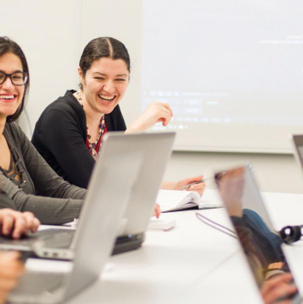 Group of students working together on computers.