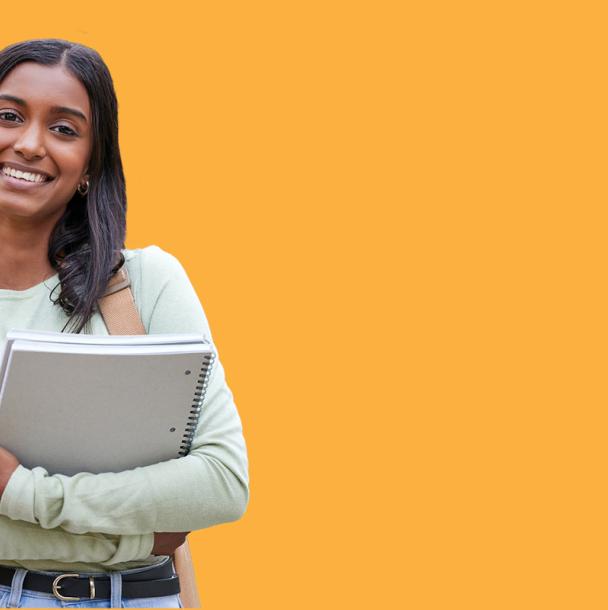 Mohawk College student smiling while holding a notebook.