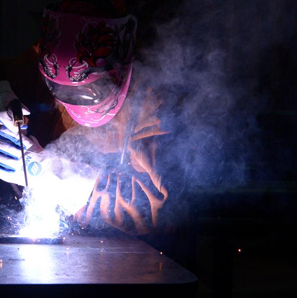 Welding student working on a project
