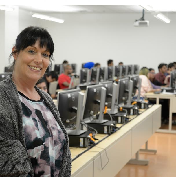 mohawk teacher smile and guiding the computer session