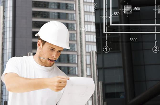 Architectural Technician student reviewing blueprints.