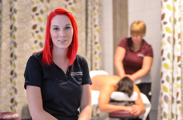 Massage Therapy student working with a student.