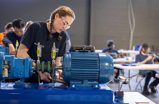 Emma Norris - 2025 Ontario Skills Competition Winner, working on a generator.