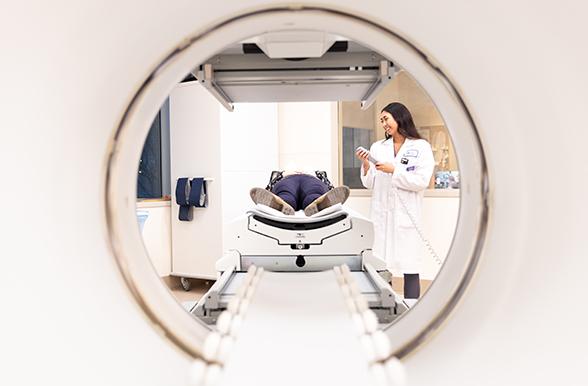 Technician operating MRI machine 